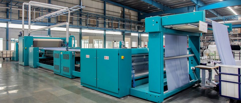Textile mill machine with fabric