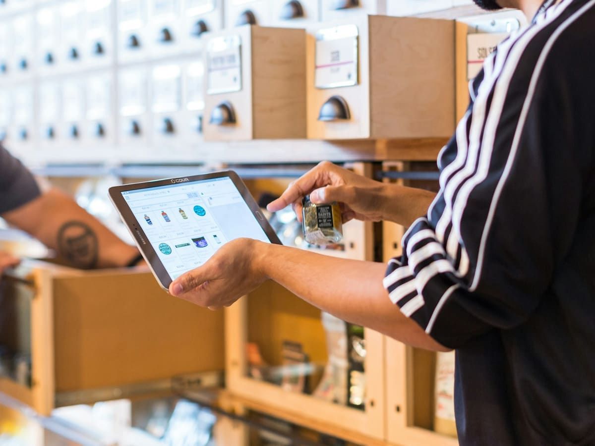 Checking goods on storage shelves with a tablet